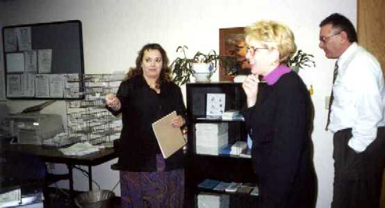 LtoR: Job Center's Nancy Heckmann shows Fred Meyers' Mary Lucas and Michael Vincent individual work spaces at the Anchorage Midtown Job Center.